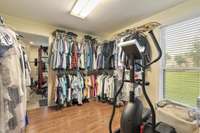 Primary Suite has a large walk-in closet WITH a "hidden room" used as a Workout Room;