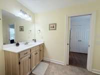 Jack & Jill bathroom with custom vanity tub/shower combo with tile flooring; Flowing into Bedrooms 2 & 3