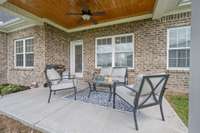 Covered back porch with wood ceiling - a custom touch and a perfect area for entertaining!