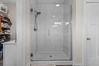 Tile shower in primary bathroom