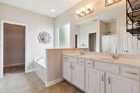 Fabulous primary bathroom with long double sink vanity