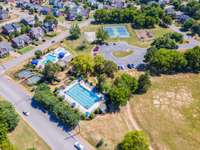 Aerial view of Willoughby Station amenity area with 3 pools, tennis courts, full basketball court, playground and social events!