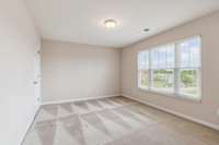 This bedroom is upstairs (1 of 3 upstairs bedrooms) and overlooks front of home.