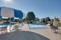 Three pools in the neighborhood, including a toddler pool with splash features