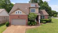 Great exterior with newer garage door and windows!