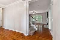 View from foyer with formal dining room to your left and family room straight ahead