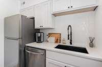 Renovated kitchen complete with modern fixtures and gorgeous tile backsplash!