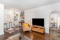 Love the mid-century mod feel in this adorable condo complete with warm hardwoods, a crisp white paint palette, and a contemporary light fixture! The open concept dining space could also be used for a home office set up!