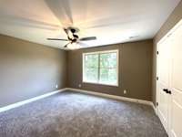Bedroom 2 with oversized closet and as always ceiling fans in all bedrooms....