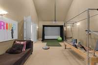 The upstairs recreation room currently hosts the golf simulater and the Pilates Reformer, but it also has equipment for your favorite movie...