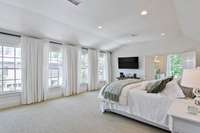 This upstairs ensuite is lined by this gorgeous wall of windows....