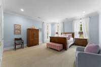 This pretty pink guest suite overlooks the back gardens and pool...