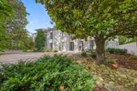 Another view....there are 5 huge and prominent Magnolia trees on this property...just perfect for a Southern Manor....