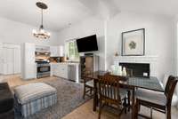 As you enter the guest cottage, you find a fireplace to your right, fully stocked kitchen for all the conveniences....