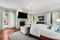 Notice this beautiful gas fireplace and matching French doors leading to the patio...