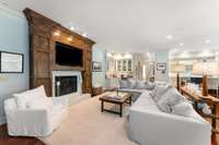Another view of the space with this fireplace with solid wood stained surround....