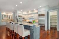 This gourmet chef's kitchen is full of surprises, but notice that this bar seats 5 comfortably!