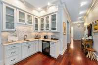 This beautiful bar has beverage fridge, sink and plenty of cabinets for all your glasswear and supplies...