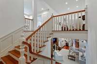 This staircase is so beautiful and extremely wide with a landing to break it up...
