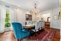 Right off the formal living room you flow in to the formal dining room...beautiful chandellier, wide cased openings and there is more of the deep crown moulding...