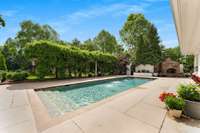 Step in and take the plunge but don't overlook the stone fireplace and gorgeous wisteria on your left...