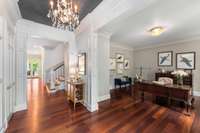 As you enter, notice the Brazilian Cherry flooring throughout the downstairs, the deep crown moulding and the 10 foot ceilings. Also, your office to your right...