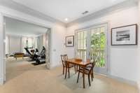 These French doors open for fresh air while you are enjoying time at the game table...also notice the workout space that is also another ensuite if you needed another bedroom...