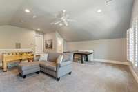 Alternate vivew of this bonus room with a view to the half bath and the HUGE walk in attic space