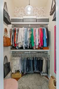 Secondary walk in closet currently used for accessories and clothing....she needs two....the gentleman has his own wardrobe with plenty of space!  :)