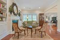 A gas fireplace, built in bookcases and cabinets, overlooking your screened in porch