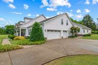 3 car side entry garages with a very large driveway for additional parking