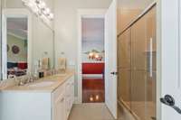 Jack and Jill bath between the 2nd and 3rd bedroom.  Double vanity and tiled shower, Artisan tile floors
