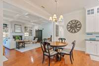 View into your kitchen breakfast area open to the cozy family room/den