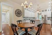 A functional yet stylish kitchen that incorporates high end materials and finishes, cabinetry extending to the ceiling, and plenty of counter space.