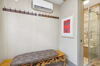 Pool house/changing room features a full bath and changing area