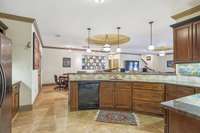 this kitchen area features a refrigerator and dishwasher