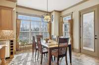 Eat-in kitchen is bright and sunny with porch access