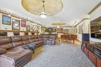 this 42x29 entertainment area features a kitchen/bar area and has plenty of room for games and a pool table
