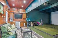 Can you believe this???  The basement area also features a golf practice area.