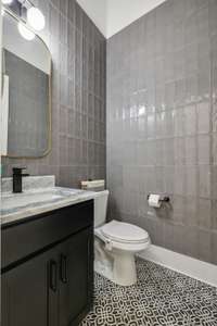 The powder room is on the 2nd floor down the hall from the kitchen/dining/living space.