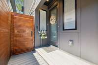 The owners built a beautiful, architecturally pleasing privacy fence and gate creating a personal walkway to the main entrance of the home. Electric lock and security features added.