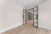Work from home in style in the main level study, featuring double doors for privacy and focus.