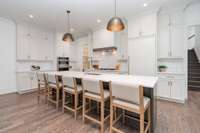Awesome Kitchen equipped with Jennaire Noir package appliances with custom made panel design.