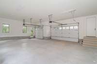 Rare 3 car garage with plenty of storage space as well as a pedestrian door and windows for plenty of light!