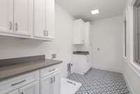 Upstairs laundry room with plenty of light!