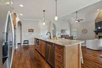 Kitchen With Stainless Refrigerator, Dishwasher And Microwave