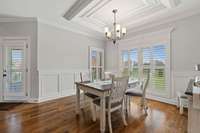 Eat In Dining Area In Kitchen With Wainscoting And Shutter Blinds Throughout Home