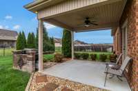 Relax under your covered patio that features the beautiful, well landscaping and a built-in grill.
