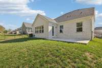 Extended patio and fenced back yard.