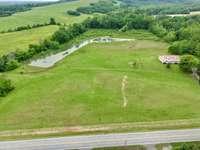Home, 15.6 Acres and large spring fed stocked pond.